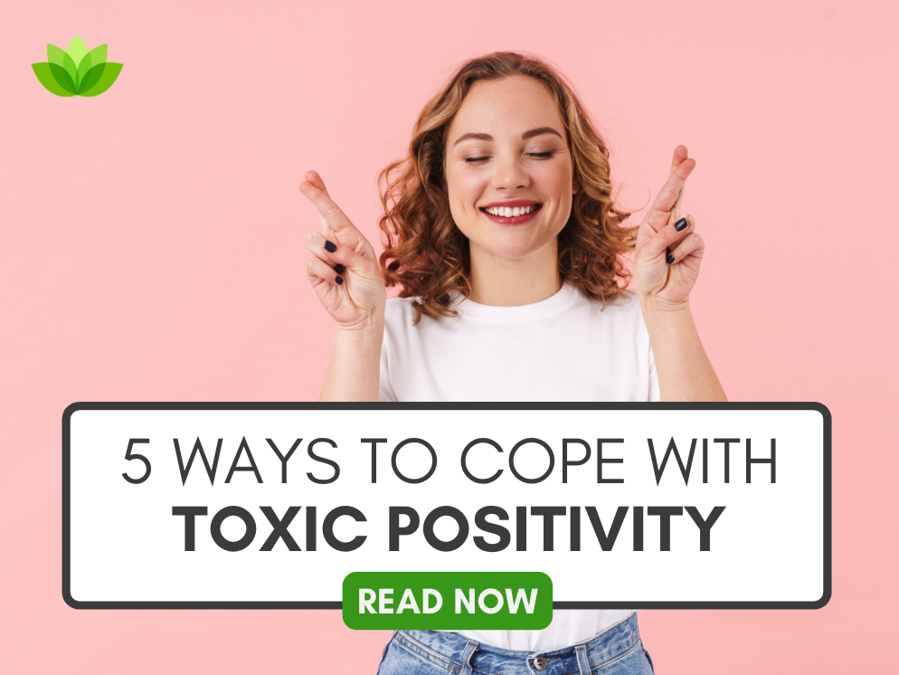 Graphic that reads "5 Ways to Cope With Toxic Positivity" from Grief Recovery Center Therapists in Houston Texas over a stock photo of a woman crossing her fingers in front of a pink background.